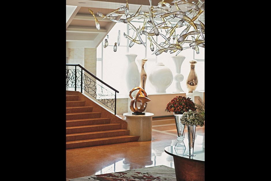 SCENES FROM THE NEWLY OPENED FAIRMONT MAKATI, INCLUDING A DRAMATIC GLASSWORKS INSTALLATION IN THE LOBBY. DESIGNER GRACE SOH SOUGHT TO FUSE PAST AND PRESENT WITH THIS AND OTHER REIMAGININGS OF TRADITIONAL FILIPINO CRAFTWORK